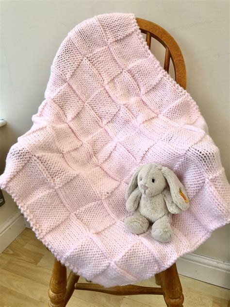 pink knitted baby blanket